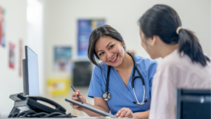Pharmacist providing patient with rapid testing services for viral illnesses like flu, COVID-19, and strep in a local pharmacy setting.