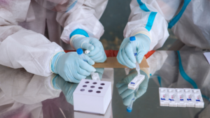 Healthcare workers performing rapid antigen tests