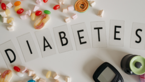 Diabetes spelled with candy and glucose meter