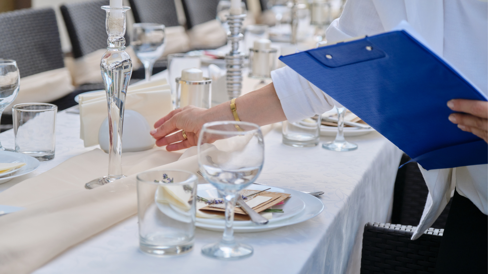 An event planner setting up a table for a wedding.