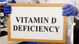 Clinician holding Vitamin D deficiency sign