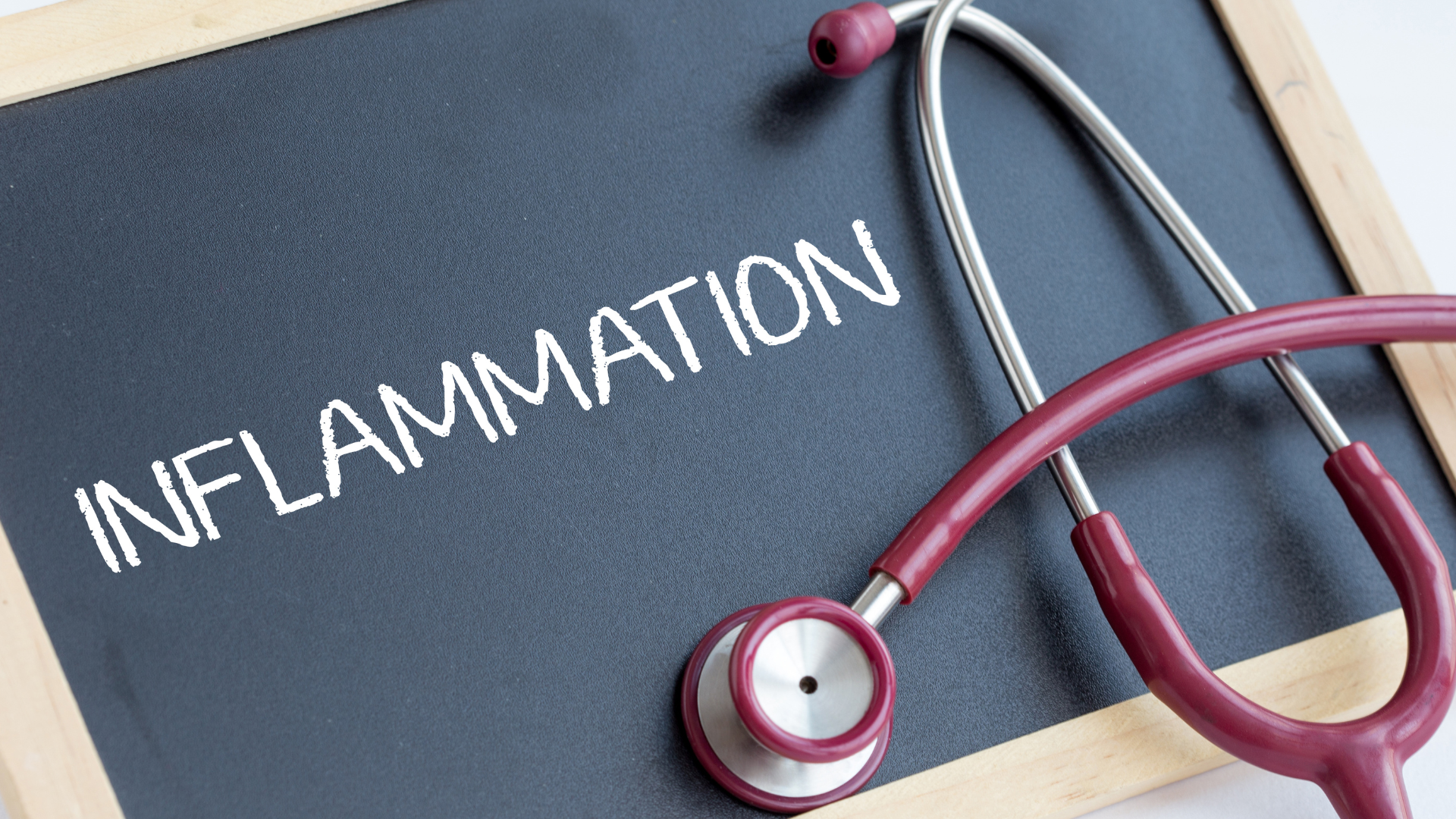 Inflammation on a chalkboard with a stethoscope on top of it. Test for Inflammation.