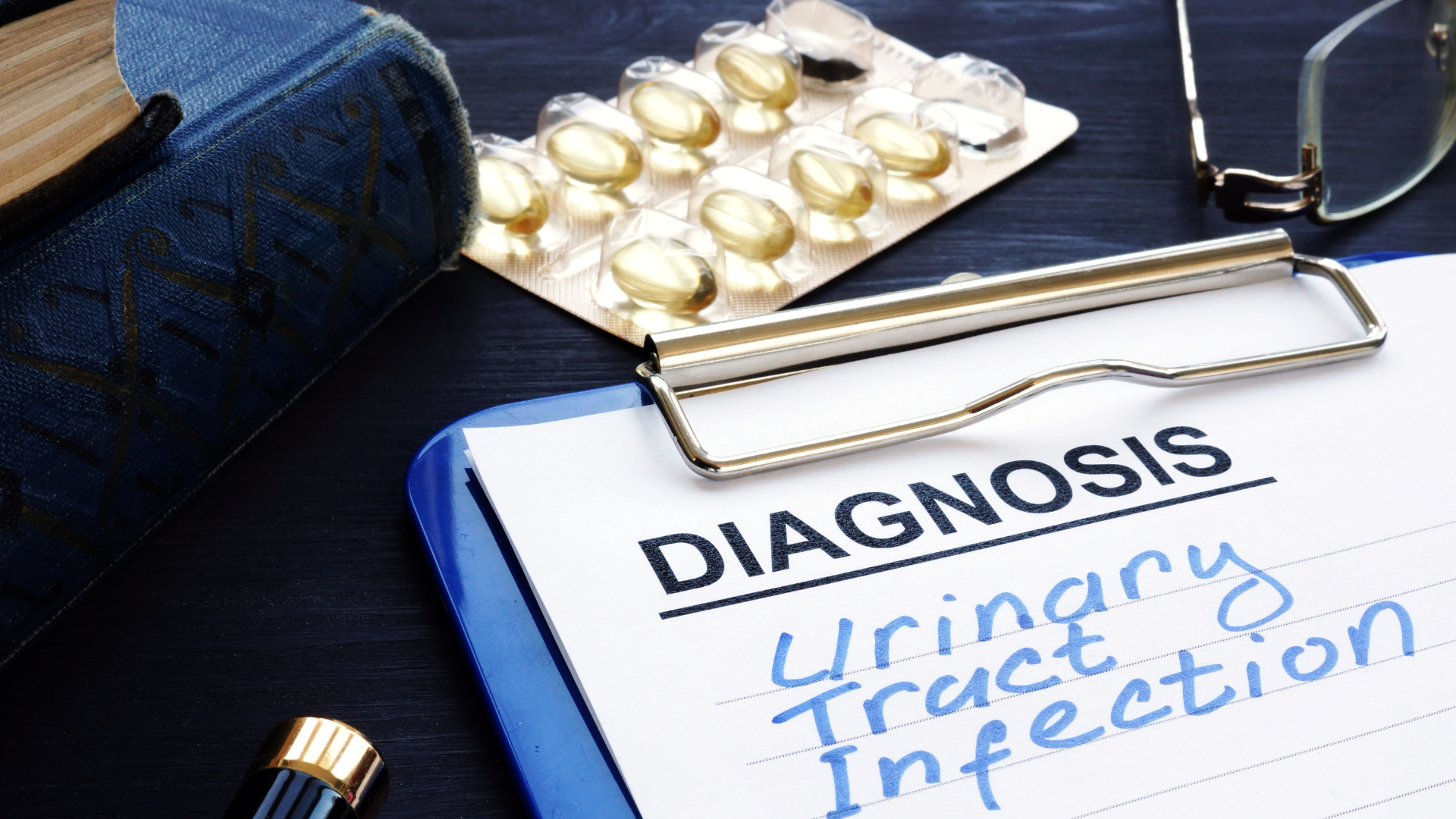 A clipboard that reads 'Diagnosis: Urinary Tract Infection'.